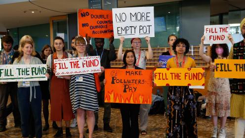 As discussions on the Glasgow Dialogue begin, members of civil society demonstrate in the corridors