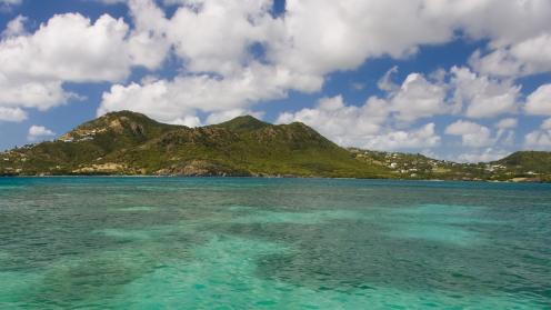 Damaged dock over turquoise waters in Antigua and Barbuda