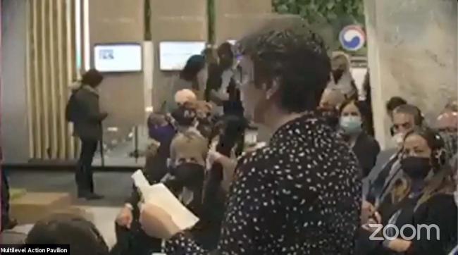 A participant poses a question to the panel