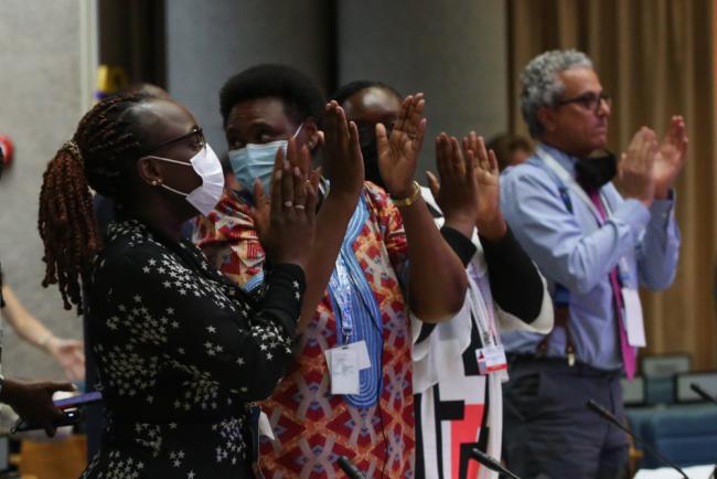 Delegates applaud during the closure of UNEP@50
