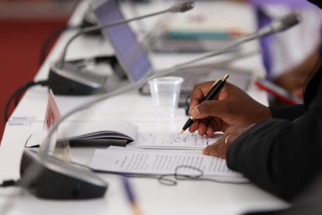 Delegates take notes during the roundtables