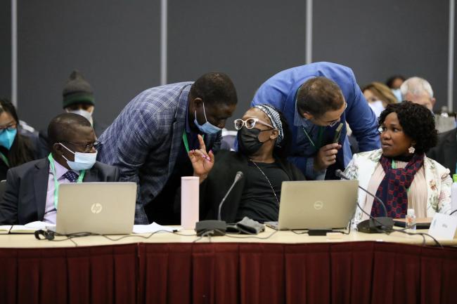 Delegates conferring during a contact group on GBF targets