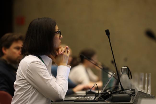 Delegates listen during the session