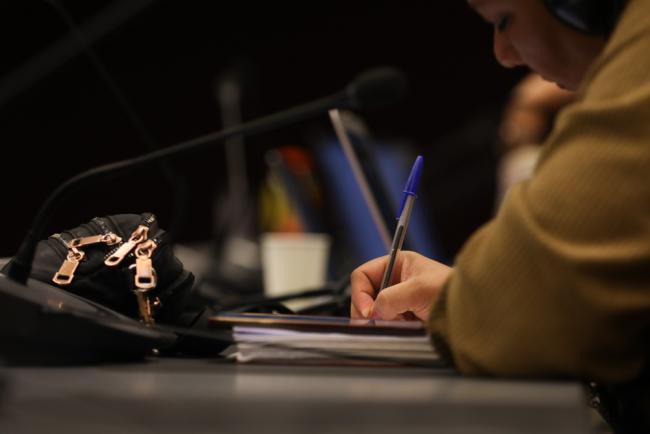 Delegate takes notes