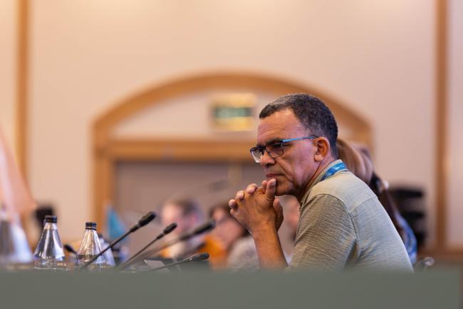 David Obura, IPBES Chair, listens to the deliberations